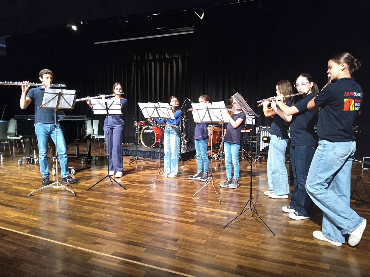 Flute players on stage at the music school's family concert