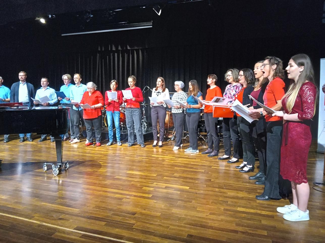Singers on stage at the music school's family concert